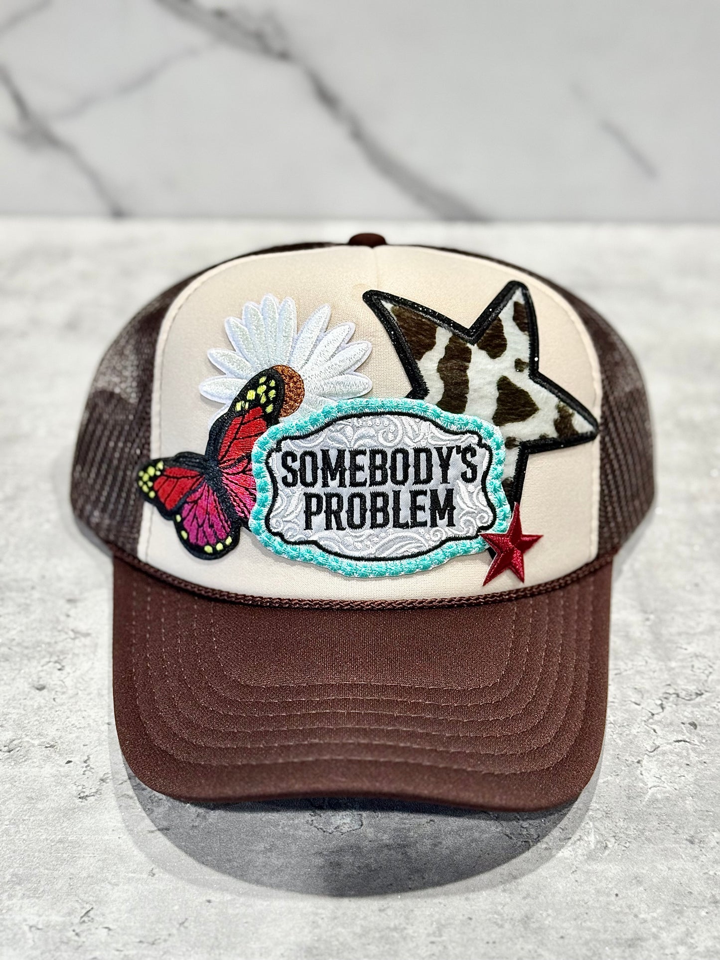 Somebody’s Problem Trucker Hat