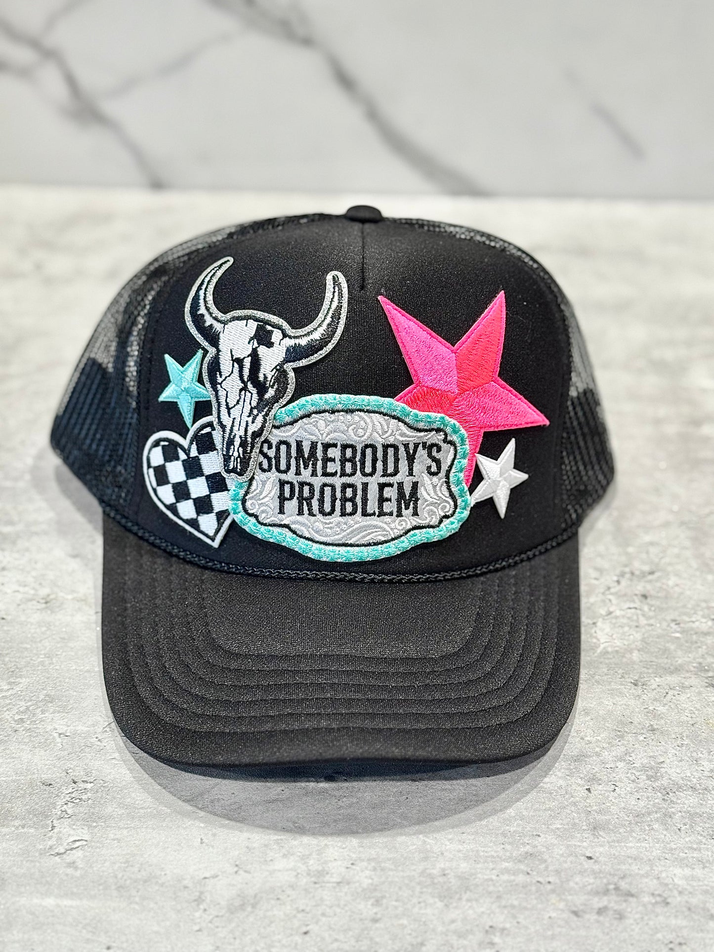 Somebody’s Problem Trucker Hat